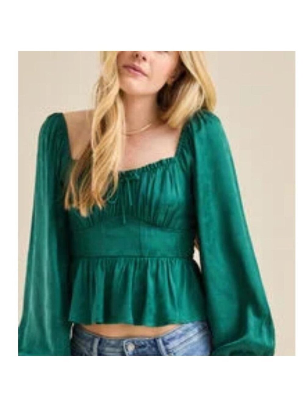Emerald green long sleeve top with ruched detailing and tie front